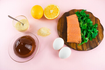 Foods containing collagen and are necessary for its synthesis. Proper nutrition. Light pink background. Copy space. Flat lay.