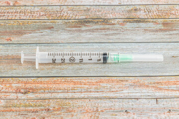 Hygienic Single-Use Disposable Syringe Injection On Wood Background