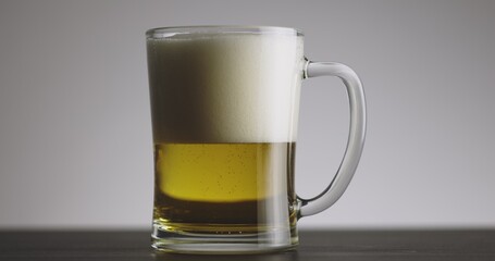 Large mug of beer on the table slow motion footage