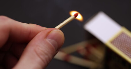 Lighting up Match in hand slow motion footage