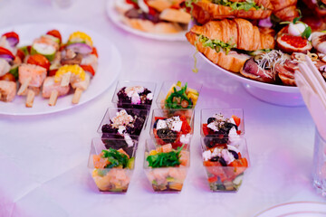 snacks in a white plate on the table for the banquet. 