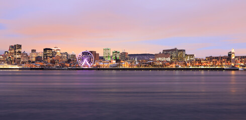 Montreal skyline and St Lawrence River at dusk in winter, Quebec, Canada