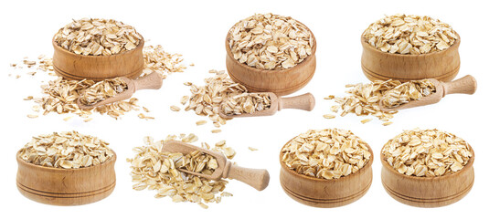 Isolated oat flakes. Wooden bowl and scoop with oatmeal