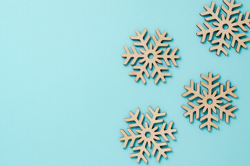 New Year or winter composition. Pattern of snowflakes on a pastel blue background. Christmas, winter, new year concept. Flat lay, top view, copy space.