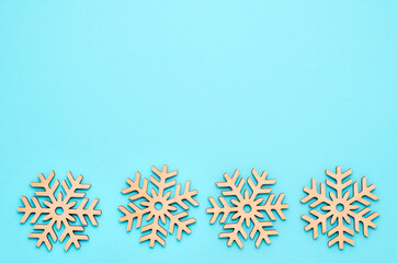 New Year or winter composition. Pattern of snowflakes on a pastel blue background. Christmas, winter, new year concept. Flat lay, top view, copy space.