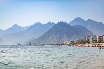 Naklejka premium Coast strewn with holidaymakers in the off-season, Konyaalti district, Liman. Antalya, Turkey - October 25, 2020.
