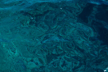 stains in the water from the sun