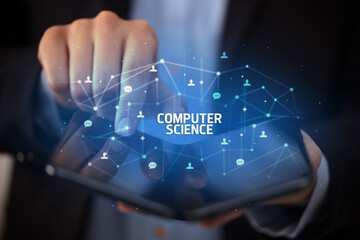 Businessman holding a foldable smartphone with COMPUTER SCIENCE inscription, new technology concept