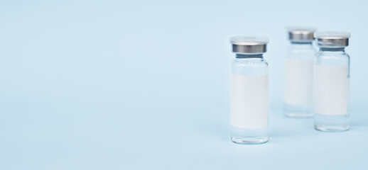 Vaccine three jars, drugs mockup. on a blue background. copy space, banner