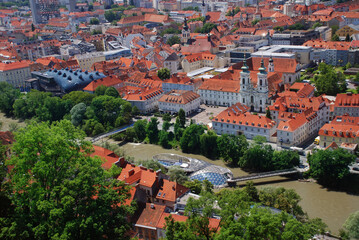 Fototapeta na wymiar A panoramic city view of the old town of Graz from the Grazer Schlossberg in summer