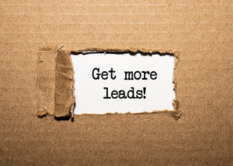 The text Get more leads. behind torn brown paper