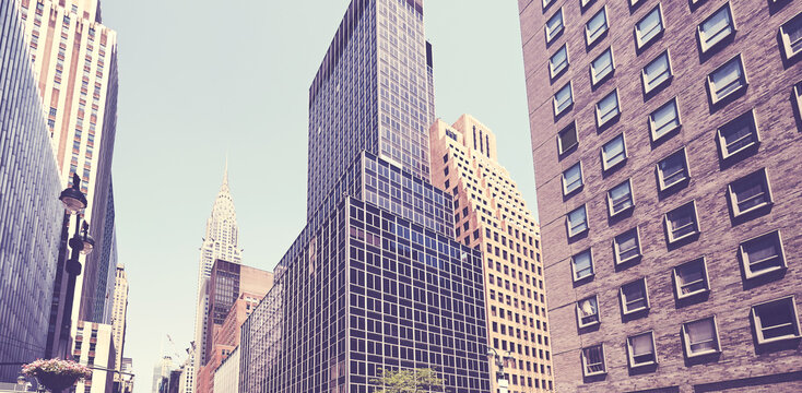 Retro stylized picture of old and modern New York City architecture, USA.