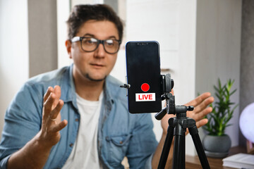 Young Video blogger recording content to channel