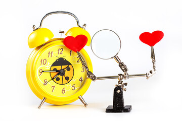 .Valentines Day background with tool third hand holding hearts and clock on white