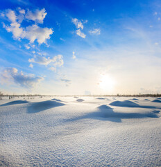 Beautiful snow hills at sunset time