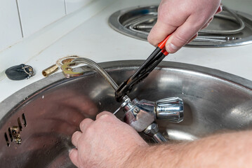 Changing a tap on the sink in the kitchen