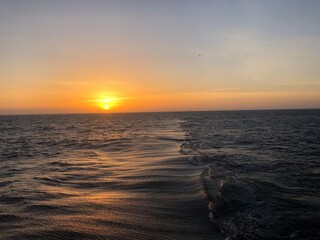Sunset over the Atlantic ocean from a sailboat