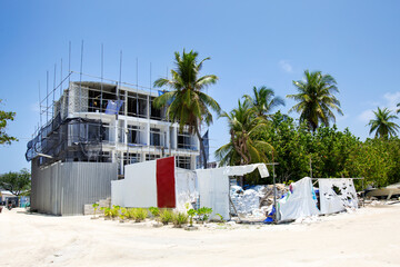 Fototapeta na wymiar Building house in tropical town. Construction site