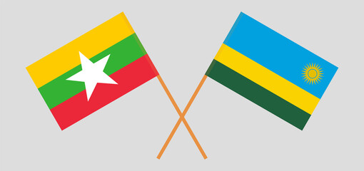 Crossed flags of Myanmar and Rwanda