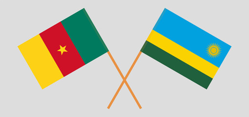 Crossed flags of Cameroon and Rwanda