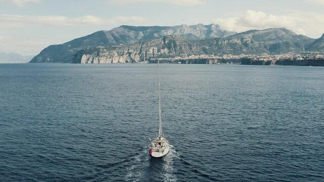 Aerial view on a yacht sailing on a sea