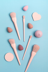 Set of pink make up brushes and beauty cosmetic products