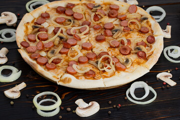 pizza with mushrooms and caramelized onions on wood background.  Top view