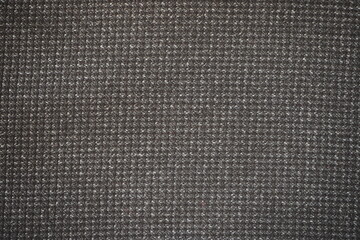 The background of gray wool fabric. A macro-tissue. costume