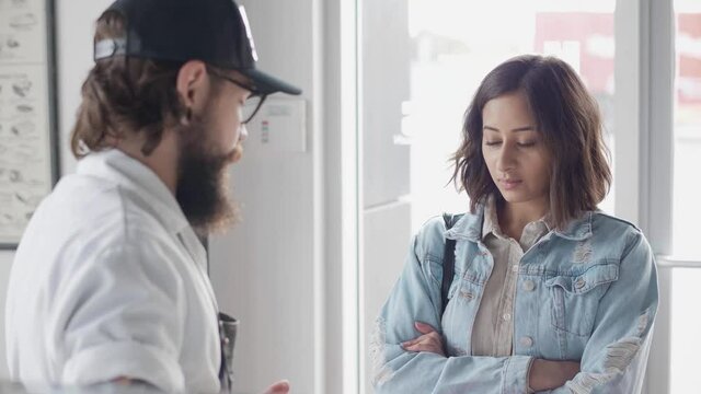 Slow Motion Of Butcher Helping Customer To Choose Meat In Shop