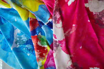 Bright collection of colorful cotton textile samples. Fabric texture background