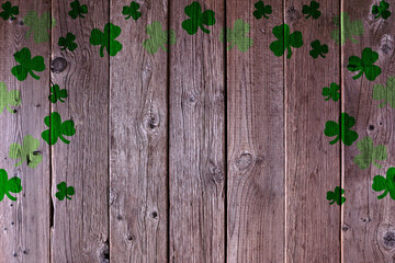 St Patricks Day shamrock arch frame on a rustic wood background. Copy space.