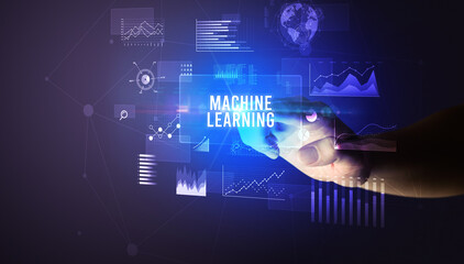 Hand touching MACHINE LEARNING inscription, new business technology concept