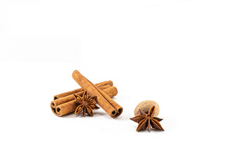 Incense for tea, anise stars with cinnamon sticks and nutmeg on a white background. Tea ceremony ingredients