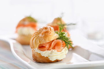 Profiteroles stuffed with cream cheese and salmon.