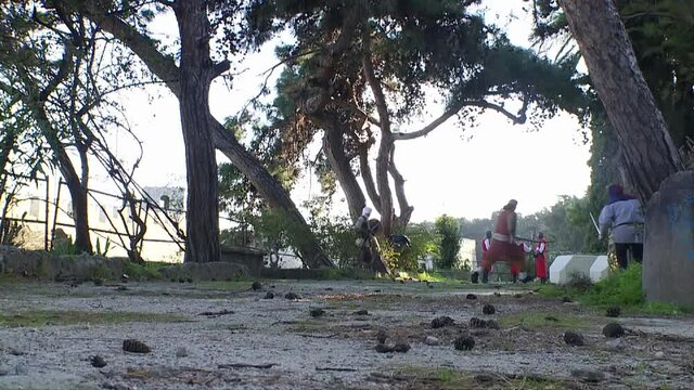 Rhodes Greece :A patrol of medieval knights guarding the main gate  of the Palace and they are being attracted by Turkish invaders during the siege o Rhodes in 1522 