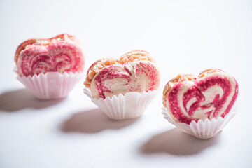 Sweet macaroons in the shape of a heart for Valentine's Day, sweets for Valentine's Day