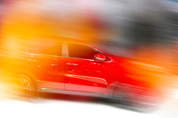 Obraz premium High-speed sports car in motion. Motion blur and abstract background.