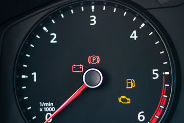 Fototapeta premium Natural light. the dashboard of the car. The engine error indicator lights up on it. Close-up.