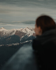 The girl looks at the mountain range