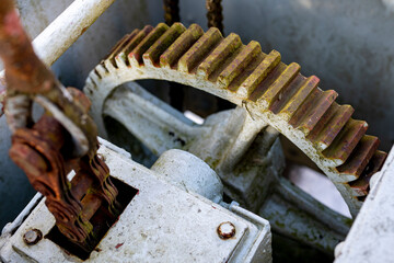 Large gears in an old gearbox. Steel structure to transfer rotational energy.