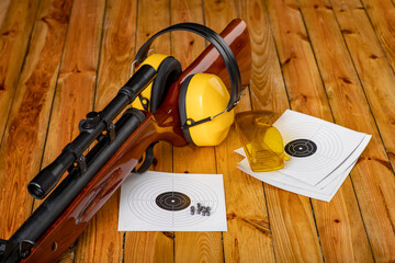 Pneumatic weapons and shooting accessories. Shield hearing protectors on the shooting range.