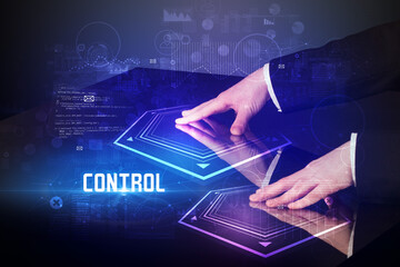 Hand touching digital table with CONTROL inscription, new age security concept