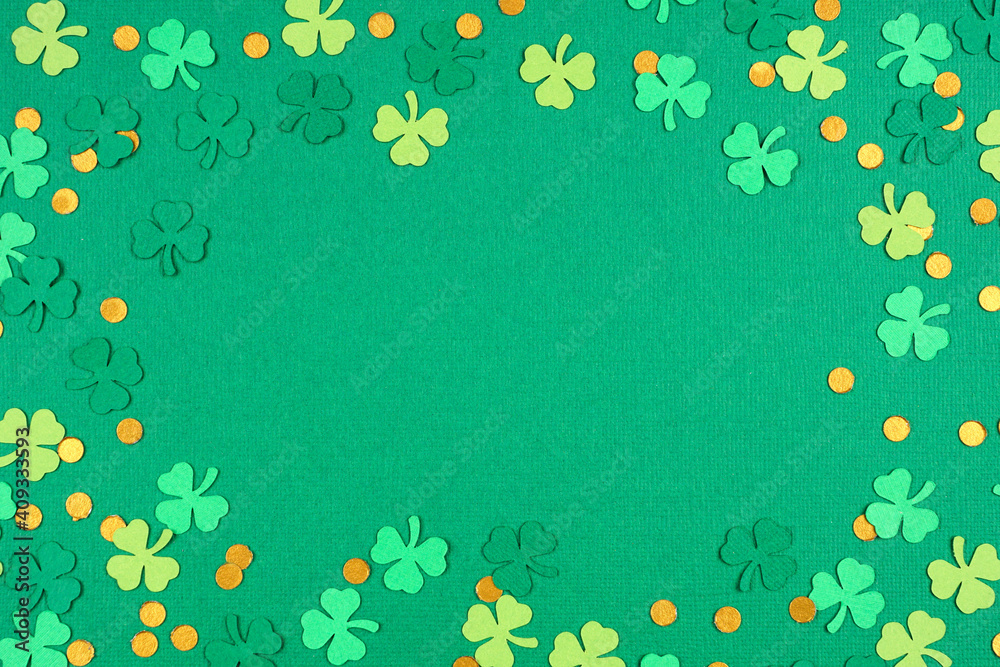 Poster St Patricks Day green background with shamrock and gold coin confetti frame. Above view with copy space.