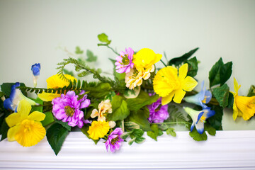 Pink and yellow flowers with green leaves