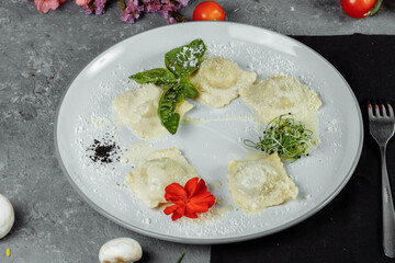 pasta ravioli with meat, tomato and basil
