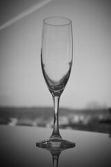 An empty transparent elegant tall glass stands on the table