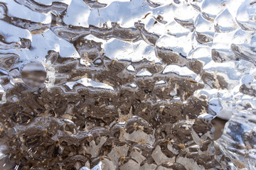 water is a frozen piece of critical ice that shines like a large dim and forms an interesting...