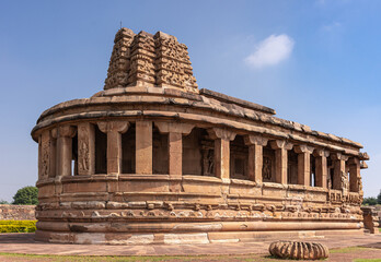 Fototapeta premium Aihole, Karnataka, India - November 7, 2013: Durga Gudi or Temple under blue cloudscape, the entire building with lost top of Vimanam.