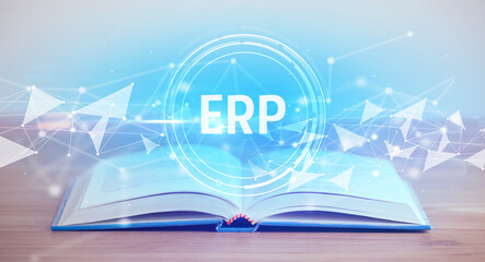 Open book with ERP abbreviation, modern technology concept