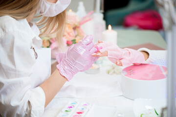 Women doing manicure. Small business existence at COVID-19 lockdown concept.